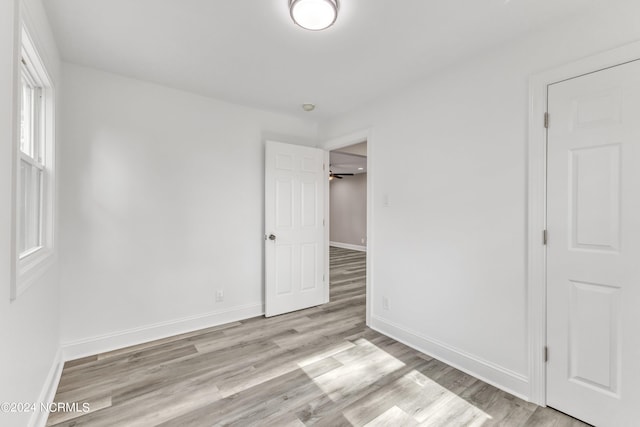 spare room with ceiling fan and light hardwood / wood-style flooring