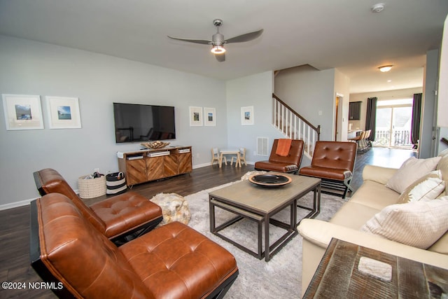 living room featuring ceiling fan and hardwood / wood-style floors