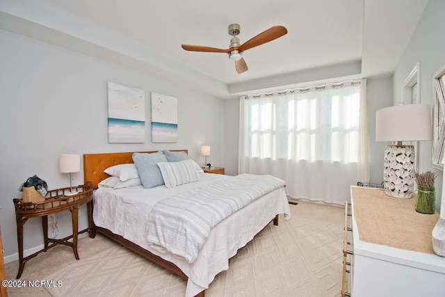 bedroom with ceiling fan and light colored carpet