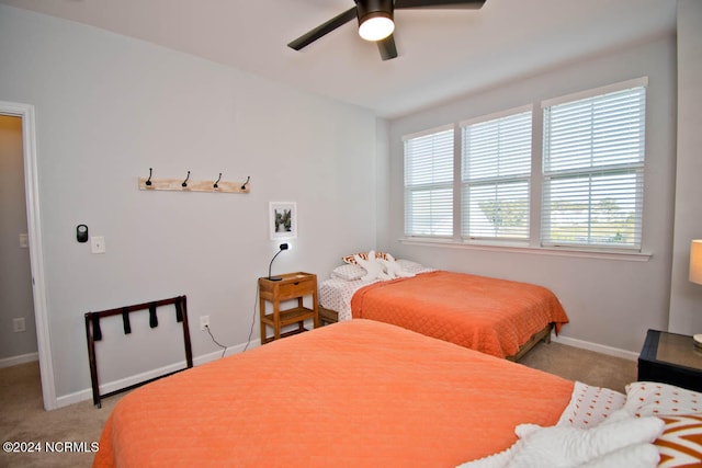 bedroom with light colored carpet and ceiling fan