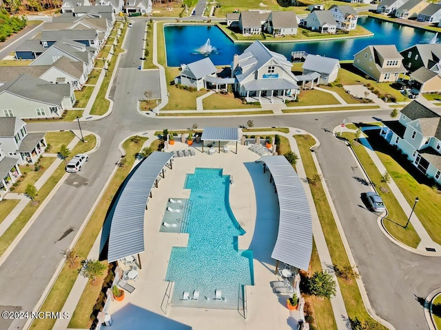 aerial view featuring a water view and a residential view
