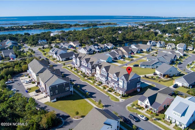 aerial view with a residential view and a water view