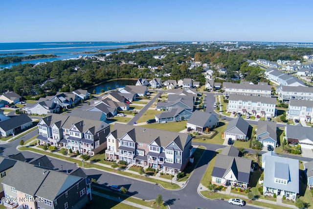 birds eye view of property with a residential view and a water view