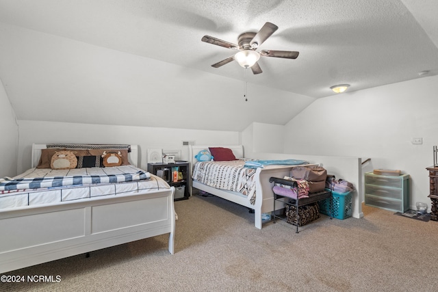 bedroom with ceiling fan, carpet floors, a textured ceiling, and vaulted ceiling