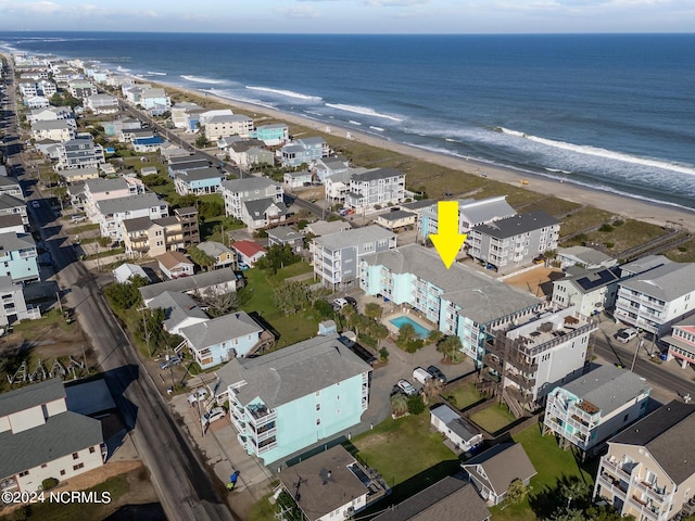 bird's eye view featuring a beach view and a water view