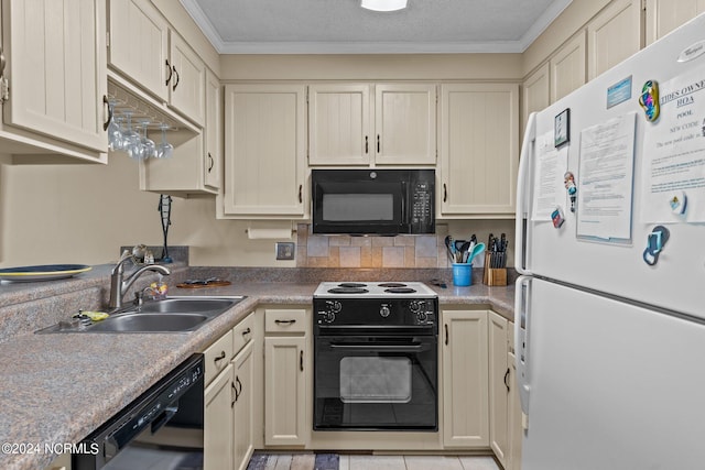 kitchen with sink, ornamental molding, a textured ceiling, cream cabinetry, and black appliances