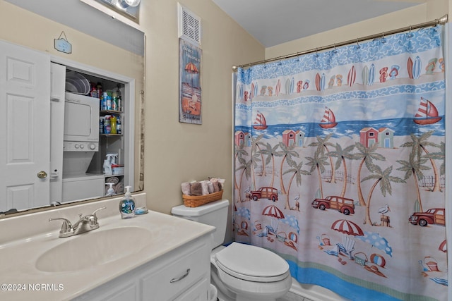 bathroom with stacked washer / drying machine, toilet, curtained shower, and vanity