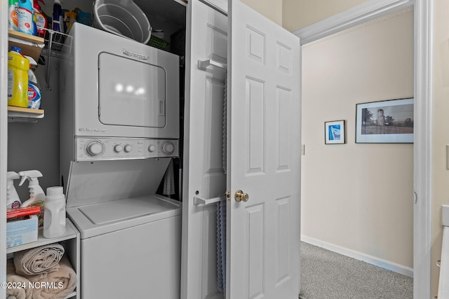 laundry area with carpet flooring and stacked washer and dryer