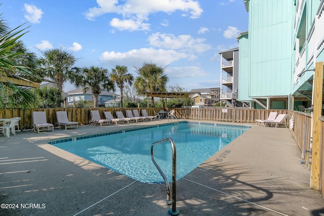 view of pool featuring a patio