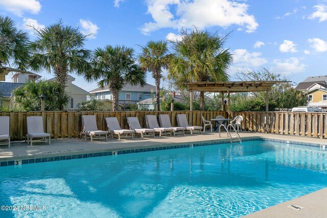 view of pool featuring a pergola and a patio area