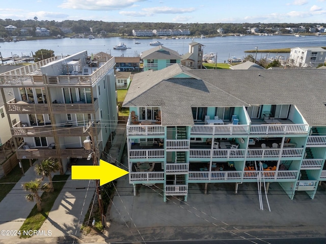 birds eye view of property with a water view