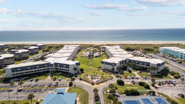 aerial view with a water view and a view of the beach