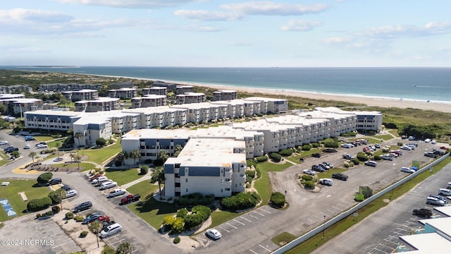 birds eye view of property with a beach view and a water view