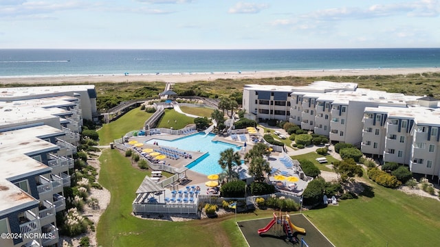 aerial view featuring a water view and a beach view