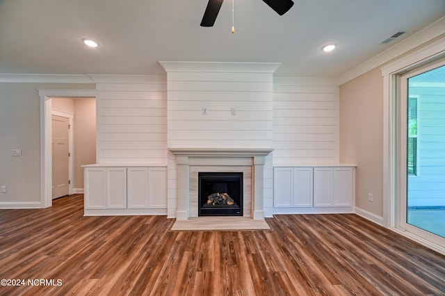 unfurnished living room with ornamental molding, dark hardwood / wood-style flooring, and ceiling fan