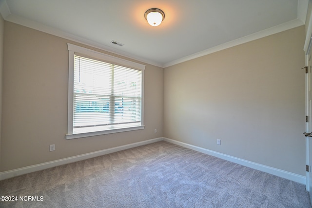 carpeted empty room with ornamental molding