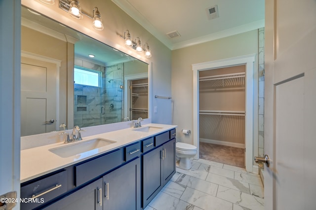 bathroom featuring ornamental molding, vanity, toilet, and an enclosed shower