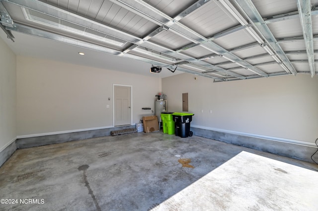 garage with a garage door opener, electric panel, and water heater