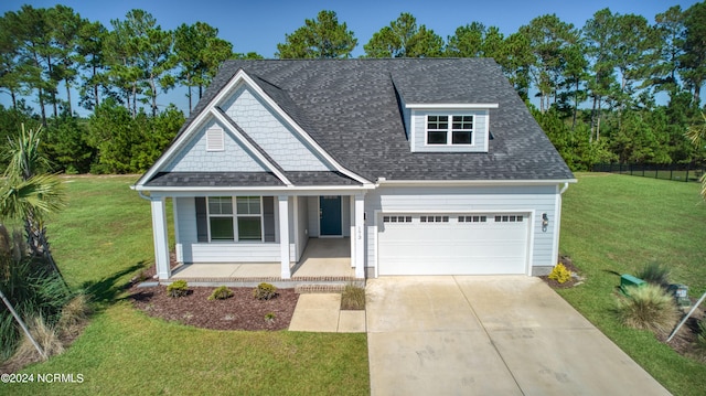 view of front of home featuring a garage and a front lawn