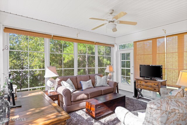 sunroom / solarium with ceiling fan and a wealth of natural light