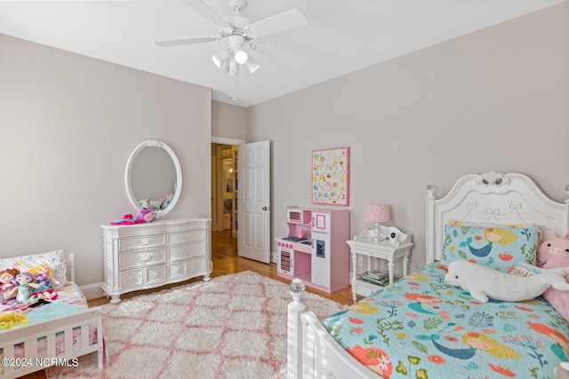 bedroom featuring ceiling fan and hardwood / wood-style floors