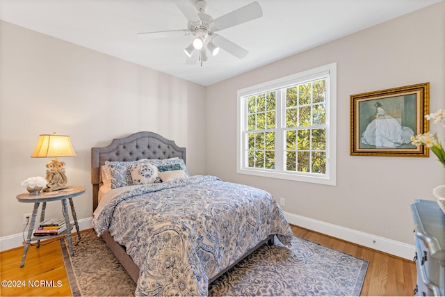 bedroom featuring hardwood / wood-style flooring and ceiling fan