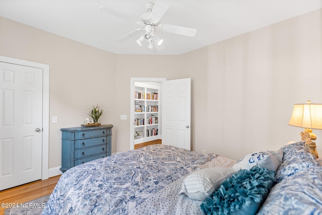 bedroom featuring ceiling fan and hardwood / wood-style flooring