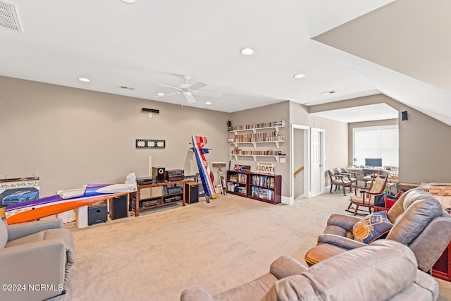 carpeted living room featuring ceiling fan