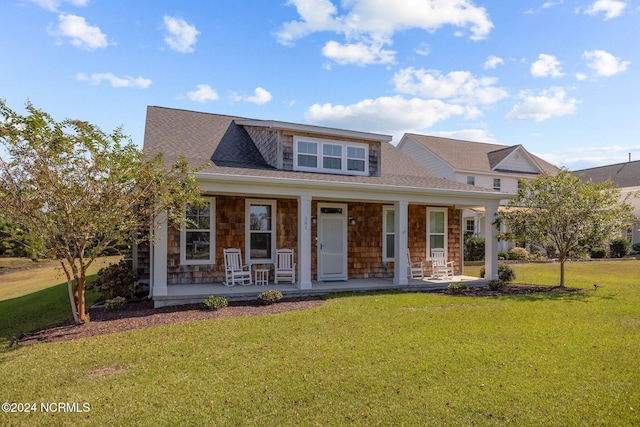 view of front facade featuring a porch and a front yard