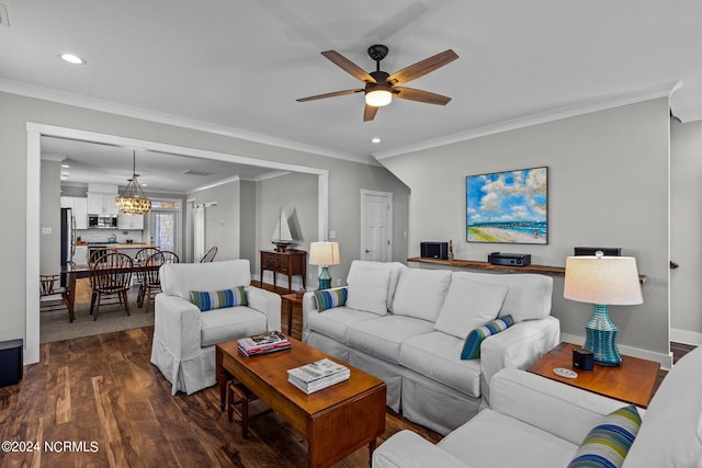 living room with ceiling fan with notable chandelier, dark hardwood / wood-style flooring, and ornamental molding