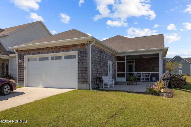 single story home featuring a front yard, a garage, and a porch