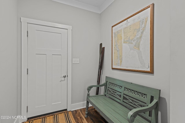 foyer with crown molding and dark hardwood / wood-style flooring