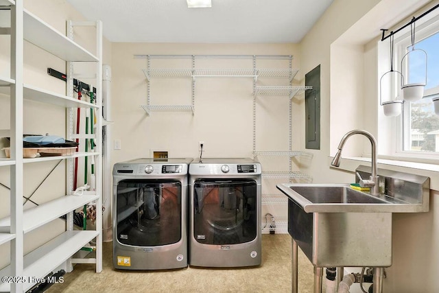 clothes washing area featuring electric panel and independent washer and dryer