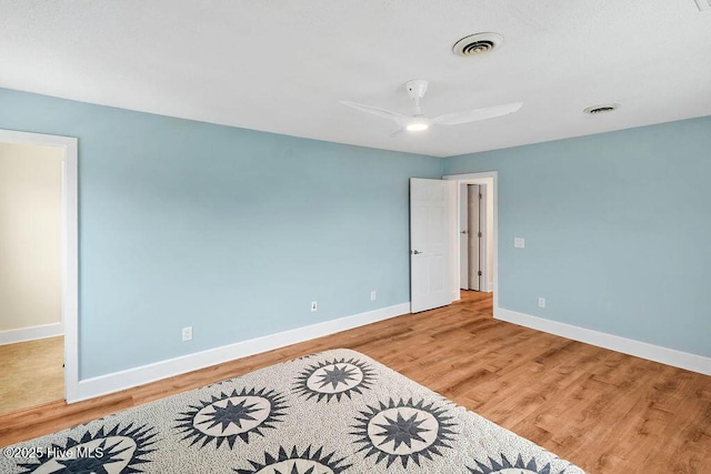 bedroom with ceiling fan and hardwood / wood-style floors