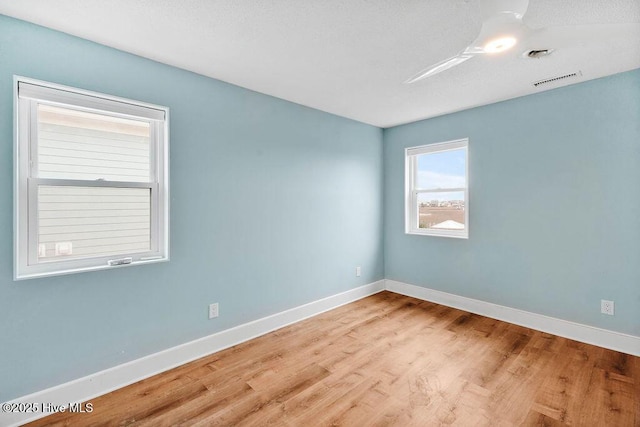 spare room with light wood-type flooring