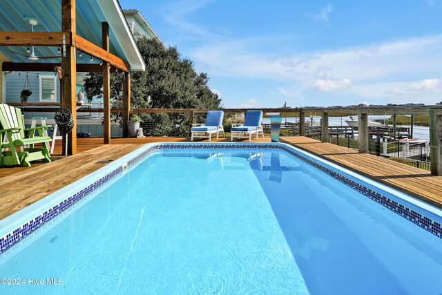 view of pool featuring a wooden deck