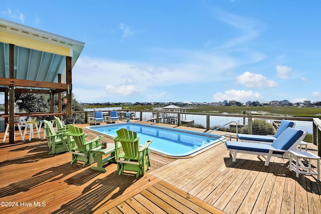 view of pool with a water view