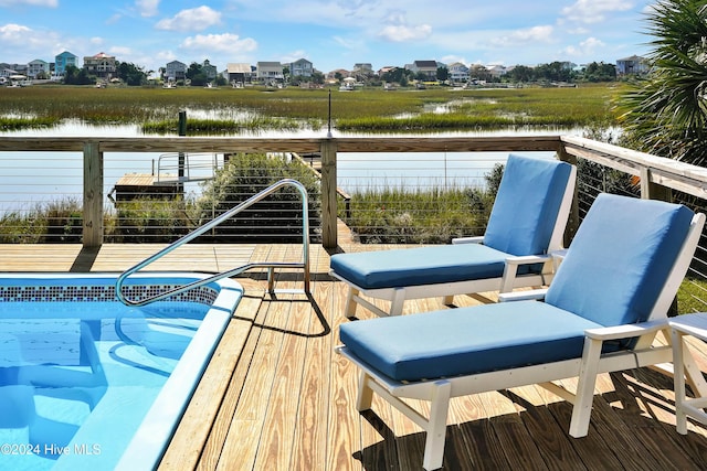 view of pool with a water view