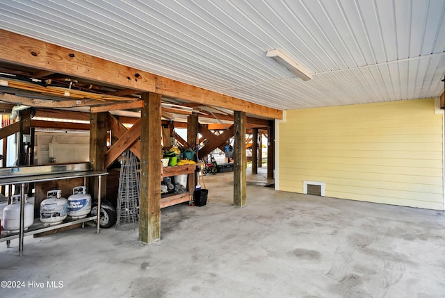 garage featuring wood walls