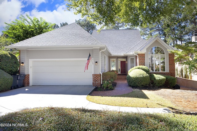 single story home featuring a garage