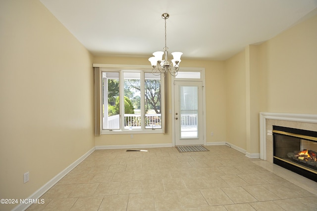 interior space with light tile patterned flooring and a chandelier