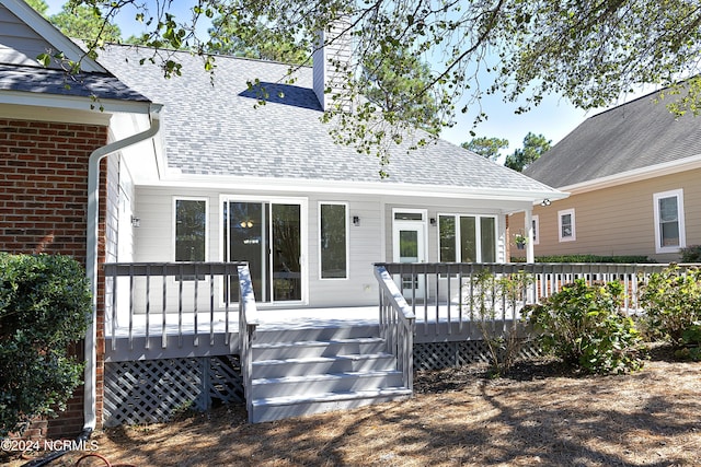 back of property featuring a deck