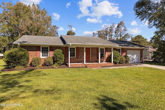 ranch-style house with a front yard, covered porch, and a garage