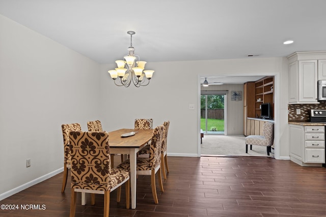 dining room featuring a notable chandelier and dark hardwood / wood-style flooring