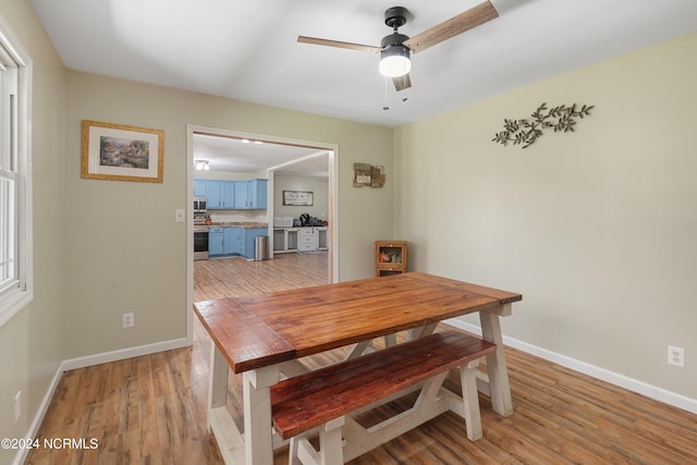 dining room featuring light hardwood / wood-style flooring and ceiling fan