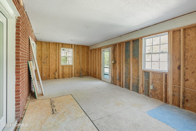 misc room with a brick fireplace