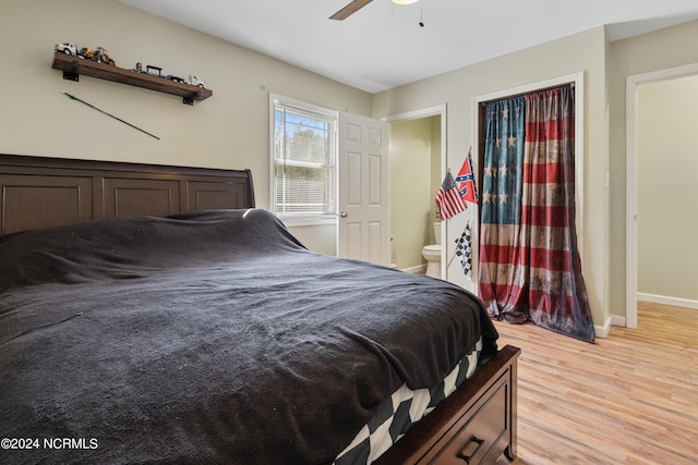 bedroom featuring ceiling fan, connected bathroom, and light hardwood / wood-style floors