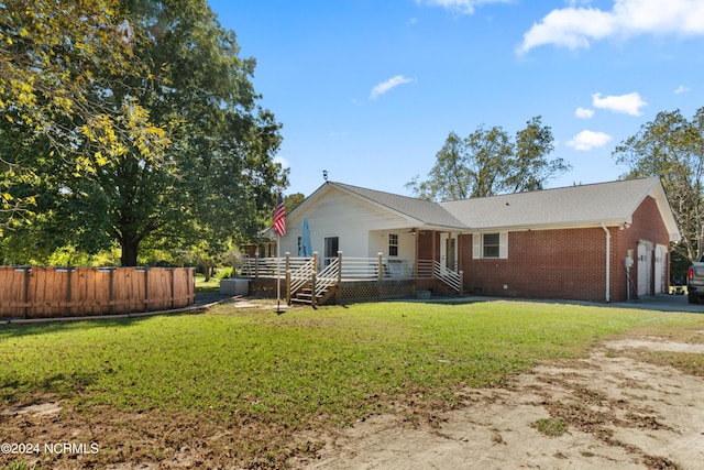 ranch-style home with a garage and a front yard