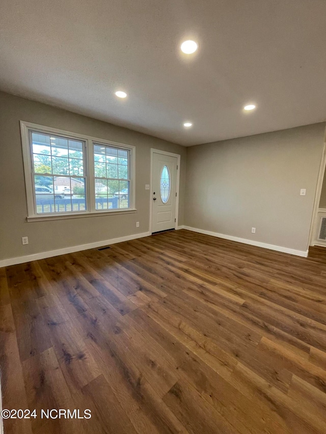 foyer with dark hardwood / wood-style floors