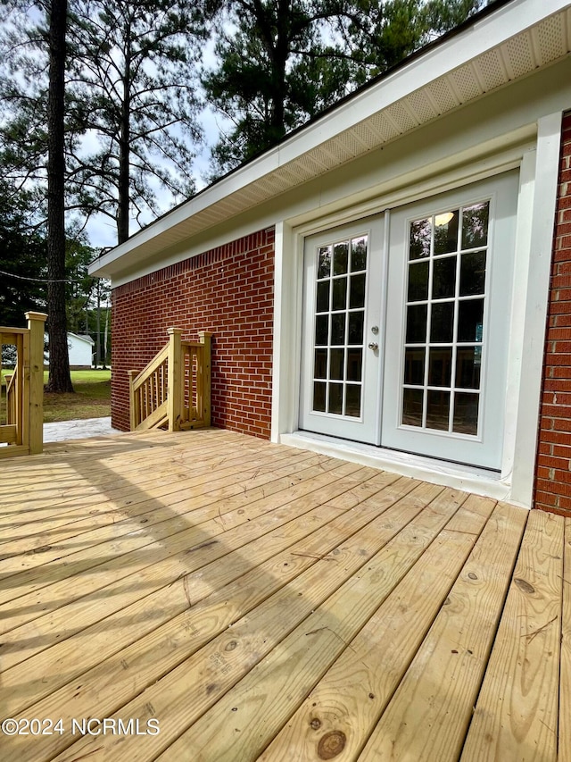 wooden deck featuring french doors